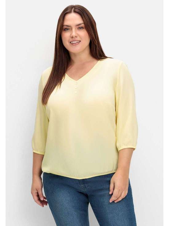 Туника с декоративной планкой на пуговицах и эластичными манжетами. Große Größen