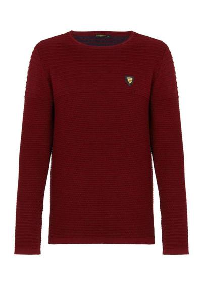 Вязаный свитер с небольшой нашивкой-логотипом.