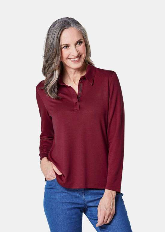 Рубашка-поло с длинными рукавами и декоративной лентой на планке с пуговицами.