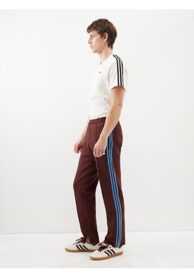 Спортивные брюки из переработанной вязки в полоску с вышитым логотипом