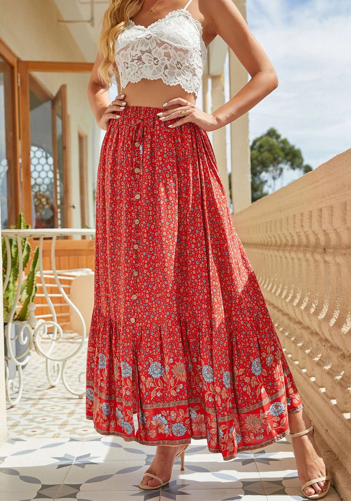 Пляжная юбка Макси-юбка с цветочным принтом и рюшами по низу, эластичный пояс.