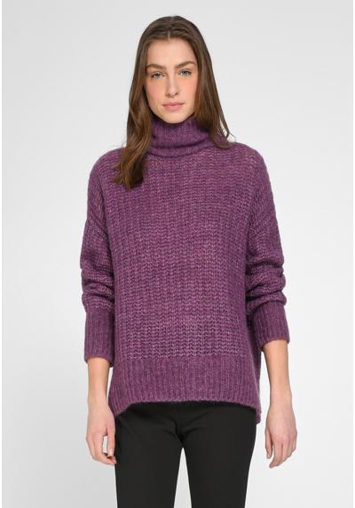 Вязаный шерстяной свитер современного дизайна.