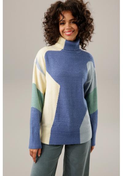 Вязаный свитер гармоничного цвета.